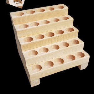 Wooden Display Rack for your Essential Oil. 5 Rows. Holds 25 Roll-on bottles, Varnished. Select the hole width from the drop-down.