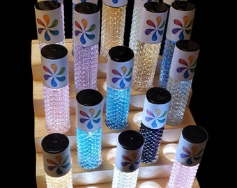 An illuminated display rack for your Essential Oils. Fits 25 roll-on bottles. RECHARGEABLE BATTERY! Select the appropriate width from menu.