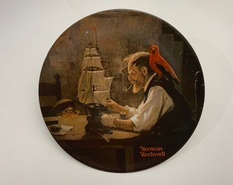 Norman Rockwell collector plates.  The Lighthouse Keeper’s Daughter, the Toymaker, the Music Maker, the Shipbuilder, the Tycoon.