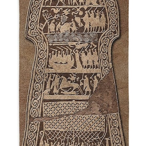 May include: A brown tapestry with a detailed image of a Viking ship and other figures. The tapestry is framed with a Celtic knot border.