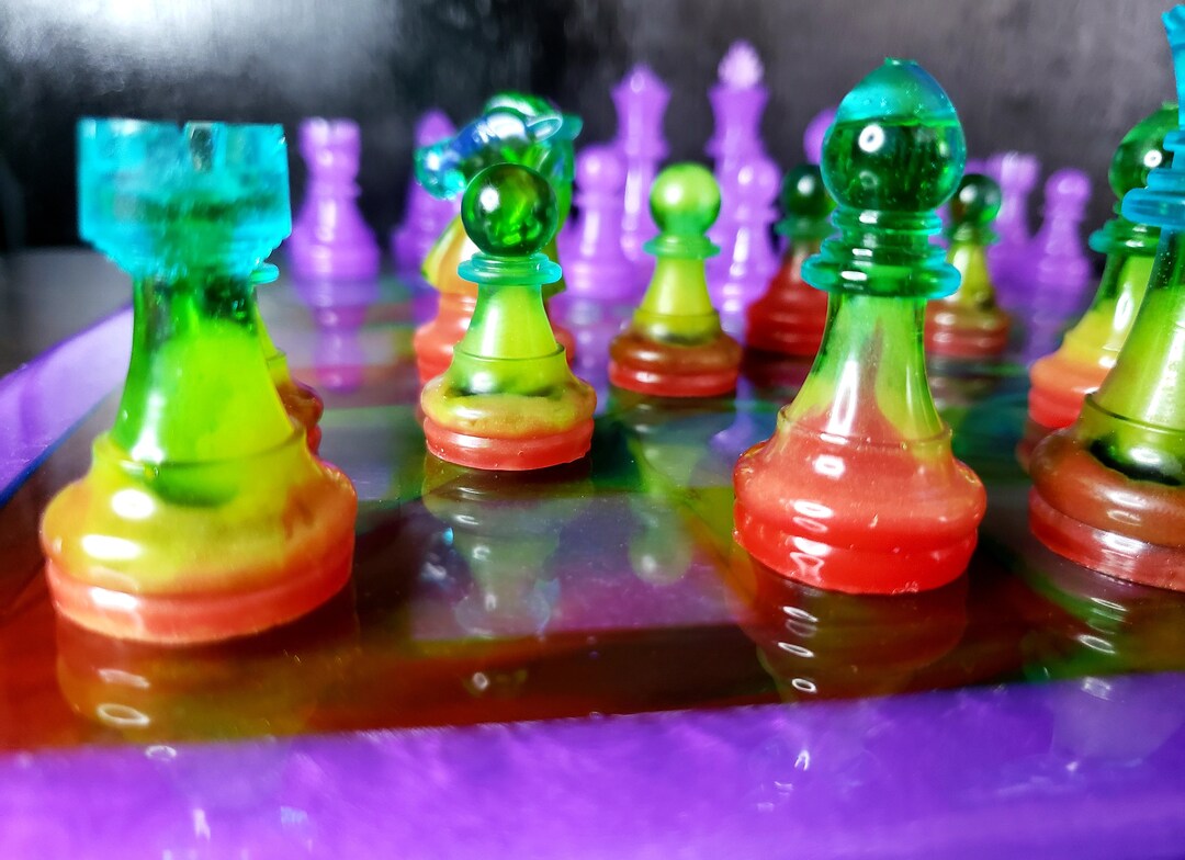 top view of a colorful crystal chess pieces in the shape of primary  geometric shapes - Playground