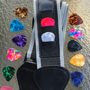 Guitar Strap and 15 Hand Punched Assorted Guitar Picks.