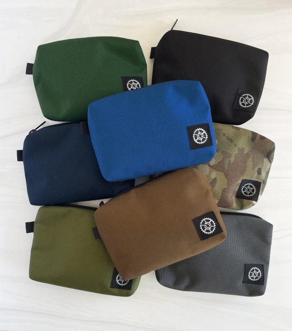 Small Pouch w Sprocket logo tag. 8 Colors. Water Resistant Nylon w/ Silver Nylon Lining. Made in USA. (Includes detachable black carabiner)