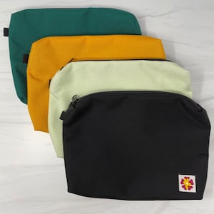 Large Pouch. 4 Colors. Water Resistant Nylon with Contrasting Lining. Made in USA. (Includes detachable black wristlet or black carabiner)