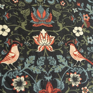 May include: A dark blue fabric with a repeating pattern of stylized flowers, leaves, and birds. The flowers are red, white, and blue. The birds are red and white.