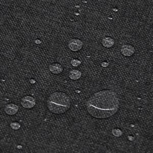 May include: A dark gray fabric with a visible woven texture featuring multiple clear water droplets scattered across the surface. The droplets vary in size and create a beaded effect on the material, highlighting its water-repellent quality.