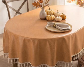 Tovaglia impermeabile personalizzata color arancione tramonto con trama in lino, disponibile in versione ovale e rotonda, ideale per decorazioni autunnali e per il Giorno del Ringraziamento, con opzioni di bordo in pizzo e frange.