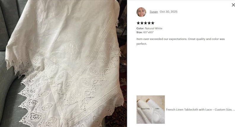May include: Natural white linen tablecloth with intricate lace detailing. The tablecloth is approximately 60 x 60 inches, featuring a delicate embroidered design. The fabric appears soft and drapes elegantly, suitable for a dining table.