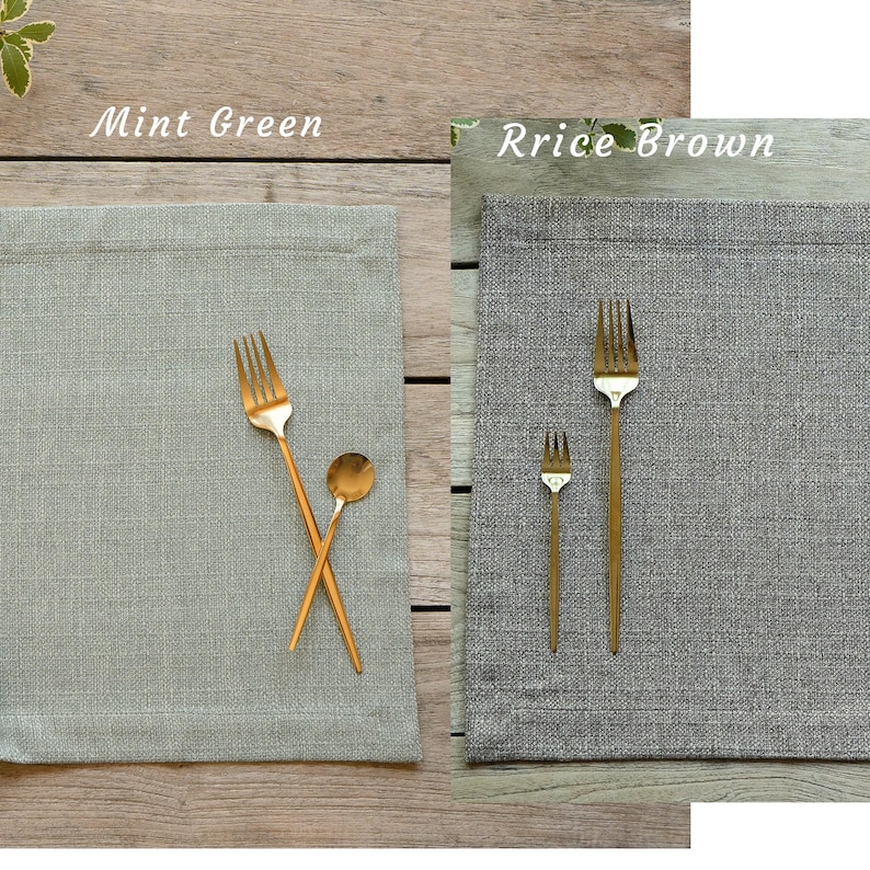 May include: Two placemats, one mint green and one rice brown, with gold forks and spoons on top. The text "Mint Green" and "Rice Brown" is printed above each placemat.