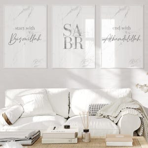 May include: Three white framed prints with marble backgrounds. The left print says "start with Bismillah". The middle print says "SABR". The right print says "end with Alhamdulillah".
