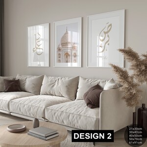 May include: Three framed prints on a white wall. The center print features a photograph of the Taj Mahal. The prints on the left and right feature Arabic calligraphy in gold.