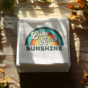 Stack of napkins with "Lake Anna Sunshine" logo and retro rainbow graphic.