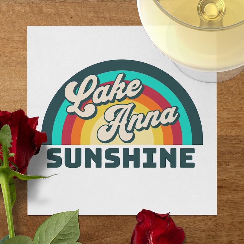 Lake Anna Sunshine text with rainbow graphic on paper, rose, and wine glass.