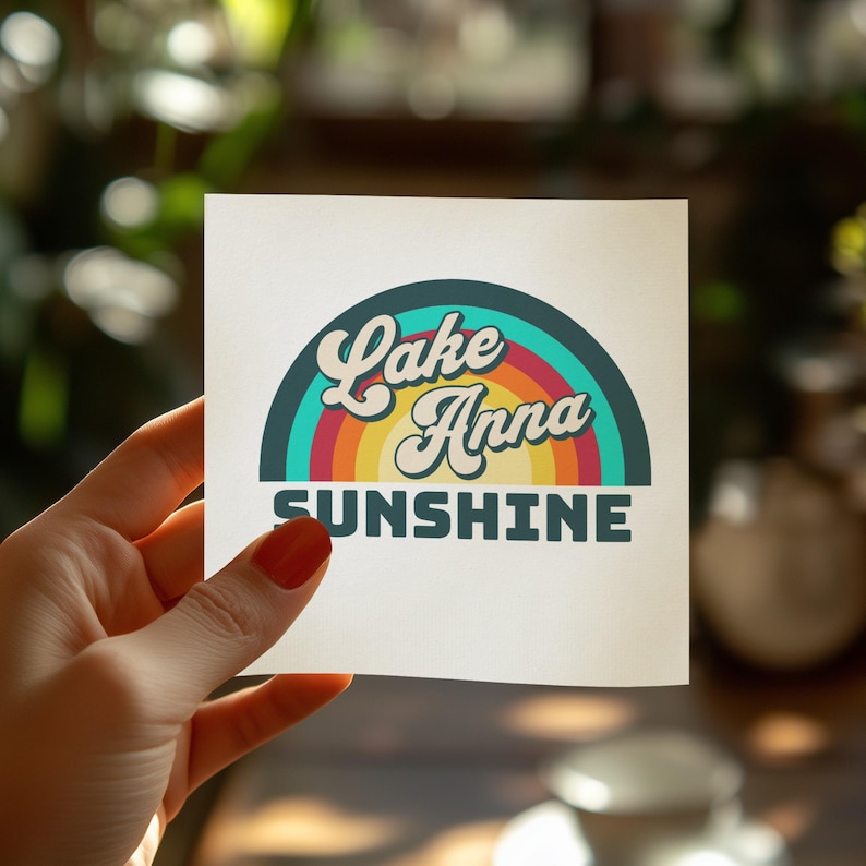 Lake Anna Sunshine text on a square sticker held by a hand.