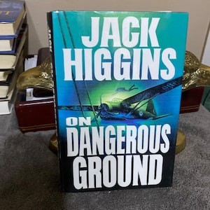 On Dangerous Ground, by Jack Higgins,  book club edition, name faintly inked ffep
