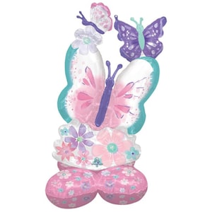May include: A large pink and purple butterfly balloon with a smaller purple butterfly balloon and flowers. The balloon is made of mylar and has a shiny finish.