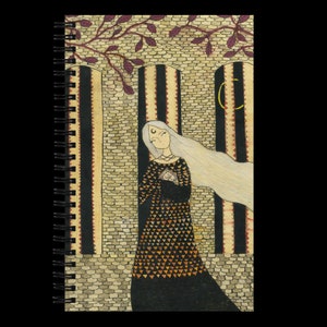 May include: A woman with long white hair stands in a stone doorway. She is wearing a black dress with a gold and orange geometric pattern. The doorway is decorated with black and white stripes and a crescent moon.