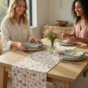 May include: A set of three ceramic mugs with a speckled, matte finish. Each mug features a different color: light blue, cream, and gray. The mugs have a simple, modern design and a comfortable handle.