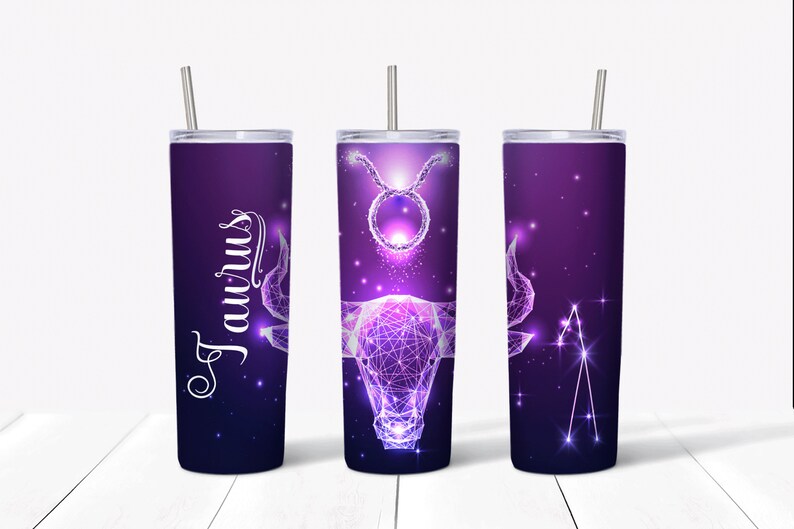 May include: Three stainless steel tumblers with a purple and black starry sky design. The tumblers feature a geometric design of the Taurus zodiac sign. One tumbler has the word "Taurus" written in white cursive.