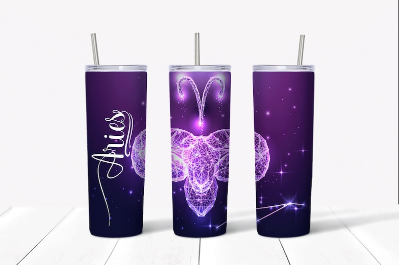 May include: Three stainless steel tumblers with a purple and white design featuring the zodiac sign Aries. The tumblers have a straw and the word "Aries" is written on one of the tumblers.