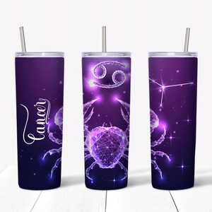 May include: Three stainless steel tumblers with a purple and blue galaxy design featuring the Cancer zodiac sign. The tumblers have a straw and a lid.