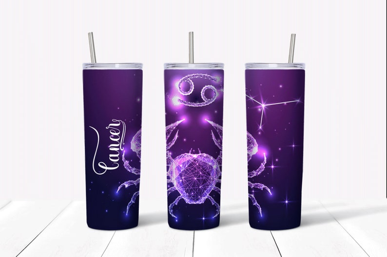 May include: Three stainless steel tumblers with a purple and blue galaxy design featuring the Cancer zodiac sign. The tumblers have a straw and a lid.