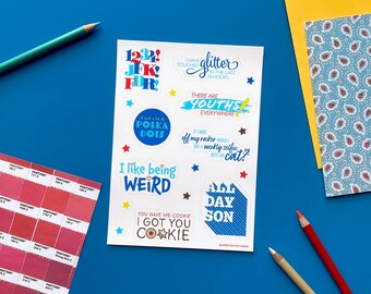 May include: A sheet of colorful stickers with various phrases and designs. The stickers include phrases like "I like being weird", "You gave me cookie I got you cookie", "There are youths everywhere", and "I have glitter in the last 24 hours".