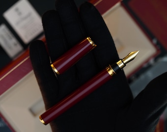 Pluma estilográfica vintage S.T. Dupont: acabado en oro de 24 k, plumín de oro de 18 k