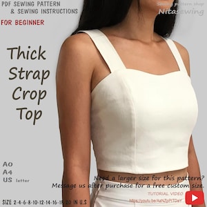 May include: A white crop top with thick straps and a straight neckline. The image includes text: PDF SEWING PATTERN & SEWING INSTRUCTIONS FOR BEGINNER, Thick Strap Crop Top, SIZE 2-4-6-8-10-12-14-16-18-20 IN U.S, AO, A4, US letter, TUTORIAL VIDEO.