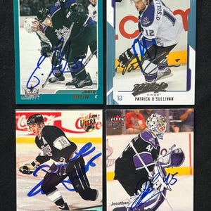 Up for sale is a Los Angeles Kings Lot of 4 -  Genuine Hand Signed Jared Aulin, Patrick O’ Sullivan, Dave Taylor, and Johnathan Bernier