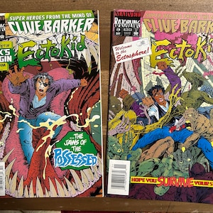 May include: Two comic book covers featuring the title "Clive Barker's Ecto Kid". The first cover shows a man in a blue shirt and a purple jacket being swallowed by a monstrous creature. The second cover shows a group of monstrous creatures in a dark, shadowy environment. The text on the first cover reads "This issue! The secret of Dex's origin leads him into... The Jaws of the Possessed". The text on the second cover reads "Welcome to the Ectosphere! Hope you survive your stay!"