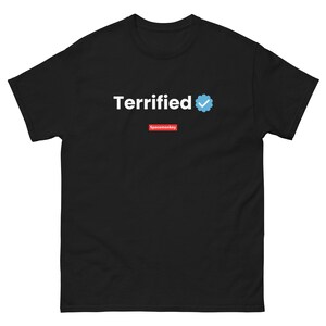 May include: Black t-shirt with the text "Terrified" in white and a blue verified checkmark icon. The text "Spacemonkey" is printed in red below the text.