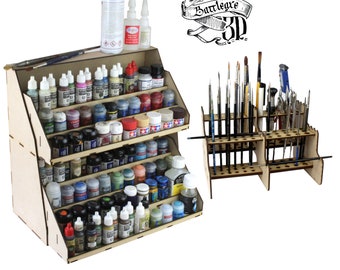 May include: A wooden paint storage organizer with multiple shelves to hold small bottles of paint. The organizer is filled with various colors of paint. A separate wooden stand holds a collection of paint brushes.