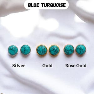May include: A collection of turquoise stud earrings in silver, gold, and rose gold settings. The earrings are displayed on a white fabric background. The text "BLUE TURQUOISE" is at the top, with "Silver", "Gold", and "Rose Gold" below the earrings.