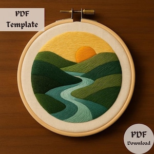 May include: Embroidered hoop art featuring a landscape with a winding river, green hills, and a yellow sun in the sky. The hoop is made of wood and has a white fabric background.