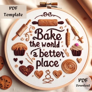 Op de afbeelding: Borduurwerk op een borduurring met de tekst "Bake the world a better place" in bruine letters. De ring bevat ook een bruine deegroller, een bruin brood, een bruine cupcake en bruine harten.