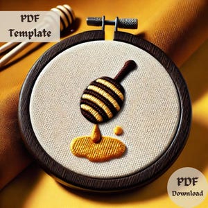 May include: An embroidered honey dipper design in a wooden hoop. The dipper is brown and yellow, with honey dripping down. The text "PDF Template" and "PDF Download" are visible.