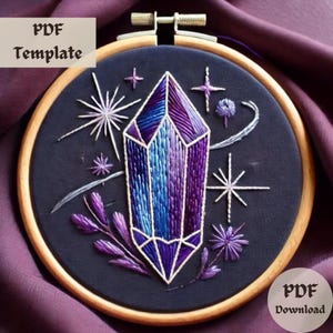 May include: Embroidered hoop art featuring a purple and blue crystal with white outlines, surrounded by white stars and purple floral accents on a black fabric background.  "PDF Template" and "PDF Download" text is visible.