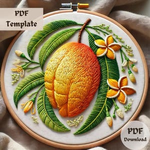 May include: Embroidered hoop art featuring a yellow and orange mango with green leaves and white flowers. The embroidery is done in a realistic style.