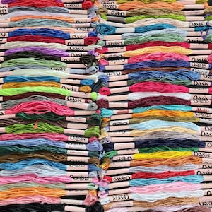 Pack of 100 colorful embroidery skeins made from high-quality material, offering a solid and attractive appearance. Each skein measures 6 to 7 meters in length and consists of 6 strands, allowing for versatile use.