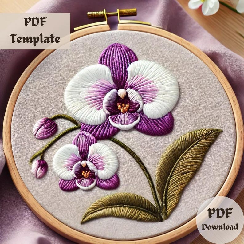 以下が含まれることがあります： 紫と白の蘭の花と緑の葉の刺繍パターン。パターンは木製の刺繍枠に表示されています。画像には「PDF Template」と「PDF Download」のテキストが表示されています。