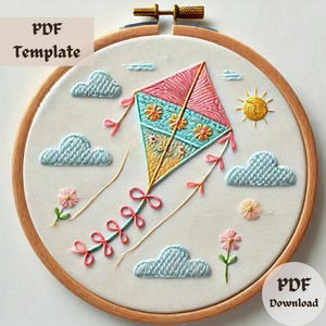 May include: Embroidery pattern PDF download for a colorful kite flying in a blue sky with clouds and flowers. The pattern is perfect for beginner embroiderers.