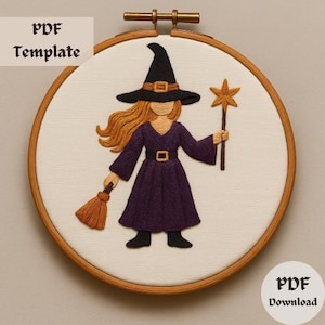 May include: Embroidery pattern for a witch with a purple dress, orange broom, and a star-topped wand. The pattern is in a hoop and ready to be stitched.