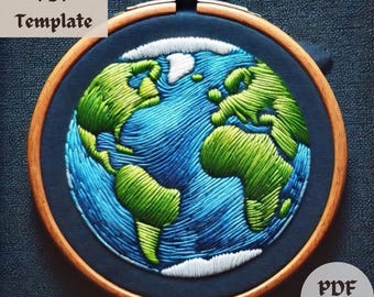 May include: A close-up of a blue and green embroidered Earth on a dark blue fabric background. The Earth is stitched with green continents and blue oceans. The embroidery is framed in a wooden hoop.