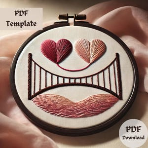 May include: Embroidered hoop art featuring two pink and red hearts connected by a brown bridge. The background is a series of pink and red waves.