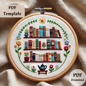 May include: Embroidered hoop art with a bookshelf design. The artwork displays colourful books on shelves, surrounded by floral and leaf embroidery. The text "PDF Template" and "PDF Download" are visible.
