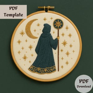 May include: An embroidered hoop art piece featuring a figure in a hooded robe holding a staff with a star emblem. The design includes a crescent moon and stars, with the text "PDF Template" and "PDF Download". The color palette includes teal, gold, and cream.