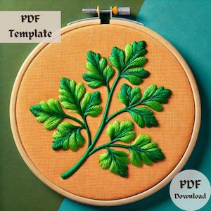 Könnte beinhalten: Grüne Petersilienblätter, die auf einem hellorangenen Stoff, der über einen hölzernen Stickrahmen gespannt ist, gestickt sind. Der Text "PDF Template" befindet sich oben links und "PDF Download" unten rechts.