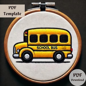 May include: Embroidered design of a yellow school bus with black windows and the words "SCHOOL BUS" on the side, displayed in a wooden embroidery hoop.