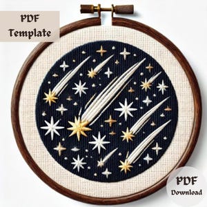 May include: Embroidered hoop art featuring a dark blue circle with white, gold, and cream-colored stars and shooting stars. The text "PDF Template" and "PDF Download" are visible. The embroidery is set in a wooden hoop.